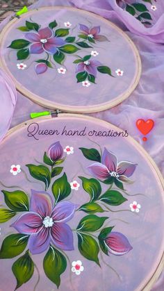 two embroidery hoops with flowers painted on them and the words, queen hand creations