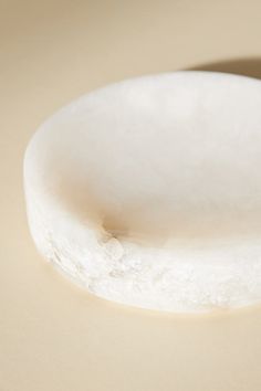 a round white object sitting on top of a table