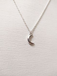 ◆ Necklace with small half moon plated in silver this necklace is very simple and elegant and has an adjustable silver chain the moon size is only 0,629921 inches! ♡ In my shop there are many handmade jewelry for all tastes, come and watch them you are welcome! ♡ Simple Design Sterling Silver Necklace, Silver Crescent Clavicle Chain Jewelry, Sterling Silver Crescent Clavicle Necklace, Nickel Free Sterling Silver Crescent Necklace, Sterling Silver Crescent Clavicle Chain Necklace, Dainty Crescent White Gold Necklace, Adjustable Simple Silver Necklaces, Crescent White Gold Sterling Silver Necklace, Crescent Shaped White Gold Sterling Silver Necklace