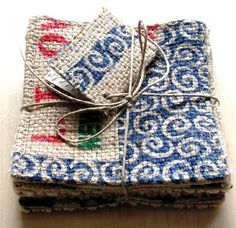 three pieces of cloth with blue and red designs on them