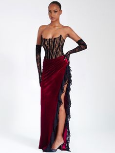 Live life like royalty with this divine piece! Featuring a strapless corset, high side slit, exposed velvet boning, and slight ruching details across the 'V' shaped waistline, it's sure to make you look and feel like a queen. Fully boned and lined with a nude-colored lining, this stunning dress is perfect for any special occasion. Now get out there and make an unforgettable statement! Pair it with our Rae Black Lace Opera-length Gloves! Available in black and red. Materials: Lace / Stretch Velve Party Maxi Dresses, Velvet Patchwork, Velvet Corset, Strapless Corset, Maxi Dress Sale, Burgundy Lace, Velvet Lace, Lace Corset, Stretch Velvet