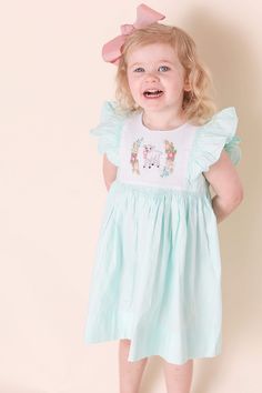 Free Shipping when you spend $75 or more. Use code PSFREESHIP at checkout. Sizing These dresses run true to size or a little big. Size H(In) 3M - 14 6M - 15 9M - 16 12M - 17 1/4 18M - 19 2T - 21 3T - 22 1/2 4T - 24 5T - 25 1/4 6 - 26 1/4 7 - 27 8 - 28 Bow sold separately. https://pleatsandstitches.etsy.com/listing/1447945867/hair-bow-in-grosgrain-ribbon-6-inch Sign up for our mailing list for 10% off your first order from our website! http://eepurl.com/cP9j4j   Please note these items are ready to ship, we cannot take custom orders nor make alterations. Thanks!   Clothing Care Instructions Most items can be washed safely in cold water on delicate cycle and hung to dry. If the item that you are ordering has red or another bright color in it next to a  white or other light color fabric pleas Cute Smocked Dress With Flutter Sleeves, Cute Fitted Smocked Dress With Flutter Sleeves, Cute Sleeveless Dress With Smocked Cuffs, Cute Smocked Dress For Baptism In Spring, Playful Smocked Dress With Short Sleeves And Ruffles, Cotton Smocked Dress With Flutter Sleeves, Cute Smock Dress With Flutter Sleeves, Playful Smocked Dress With Ruffles And Short Sleeves, Cotton Dresses With Smocked Cuffs For Playtime