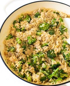 broccoli and rice in a skillet with a spoon