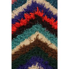 multicolored crocheted rug with an animal on the top and bottom corner