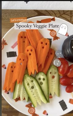 a white plate topped with cucumbers and carrots next to a can of spooky veggie plates