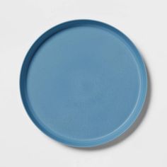 a blue plate sitting on top of a white table