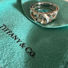 Tiffany & Co. Paloma Picasso Loving Hearts Ring 925 Sterling Silver Bought At Tiffany & Co. In Las Vegas Retired Design Excellent Condition Minor Wear Could Use A Simple Cleaning & Polishing Will Come With Protective Pouch Love Ring Tiffany & Co., Elegant Stamped 925 Heart Ring, Elegant Heart Ring Stamped 925, Designer Sterling Silver Jewelry For Anniversary, Elegant Double Heart Rings For Formal Occasions, Elegant Heart Cut Jewelry With Hallmarks, Luxury Sterling Silver Heart Cut Ring, Designer Silver Heart-shaped Jewelry, Designer Silver Heart Jewelry