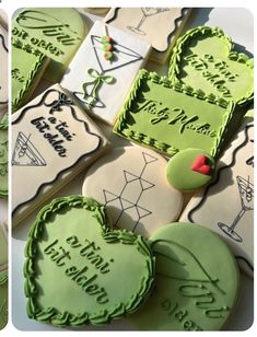 decorated cookies with green frosting and writing on them