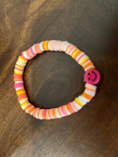 a close up of a bracelet on a table