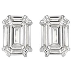 This elegant pair of diamond stud earrings showcases two emerald cut diamonds with a total weight of 0.88ct. They are graded at E-F in color, VS1-VS2 in clarity and measure 7.80 x 5.40mm. They are set in a double prong, 18k white gold setting. Modern Emerald Cut Diamond Earrings, Timeless Emerald Cut Diamond Earrings, Gia Certified Baguette Cut Timeless Diamond Earrings, White Emerald Cut Diamond Earrings, Timeless Emerald-cut Vvs Clarity Diamond Earrings, Timeless Emerald Cut Diamond Earrings With Vvs Clarity, Timeless Emerald Cut Vvs Clarity Diamond Earrings, Classic Platinum Emerald Cut Diamond Earrings, Classic Emerald Cut Platinum Diamond Earrings