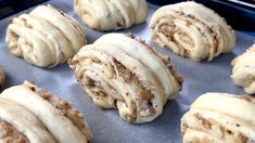 freshly baked pastries are sitting on a baking sheet