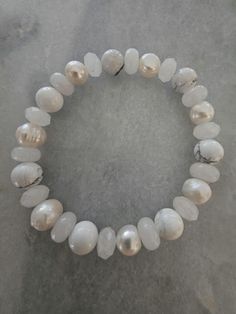 This beautiful white stretch bracelet incorporates howlite,pearls and white jade! Fits a wrist up to 8 inches. Its a stretch bracelet so pop on and go. White Beaded Bracelet, White Beads Bracelet, White Bracelet, White Bracelets, White Jade, White On White, White Beads, Stretch Bracelet, Last Minute Gifts