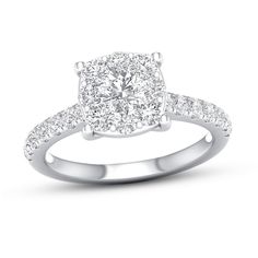 a diamond engagement ring on a white background