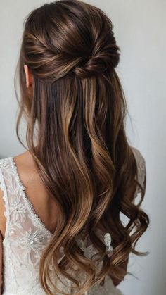 a woman with long hair in a half - up braid, wearing a white dress