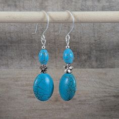 Handcrafted with bright blue green colored magnesite and silver and secured with sterling silver filled ear wires. This stone has an appearance similar to turquoise for a fraction of the cost. A cute silver flower bead adds some character to these delightful earrings. Stones will have natural variations and are dyed and stabilized. Clean with mild soap and a soft cloth. Avoid chemicals and ultrasonic cleaning. Handmade by me here in the US. I've made jewelry for many years but mostly gave it awa Earrings Stones, Teal Earrings, Made Jewelry, Silver Flowers, Ear Wire, Mild Soap, Beaded Flowers, Bright Blue, Teal Blue