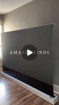 a large screen with the words amazofinds on it in front of a window