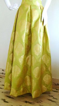 Lime green brocade box pleat skirt Elegant Green A-line Maxi Skirt, Elegant Green Flowy Maxi Skirt, Elegant Yellow Silk Skirt, Elegant Long Yellow Skirt, Green Pleated A-line Skirt, Green A-line Dress With Lined Skirt, Elegant Yellow Pleated Skirt, Elegant Green Pleated Maxi Skirt, Elegant Yellow Maxi Skirt