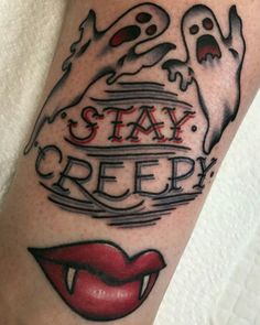 a tattoo with the words stay creepy on it and red lips, ghosty eyes