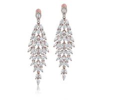 Step into a world where elegance meets glamour with these chandelier earrings. Crafted to catch the light at every turn, this stunning style features marquise-cut Diamonique simulated diamonds, gracefully suspended from a polished rosetone finish that adds a warm, radiant glow to any ensemble. Stunning Style, Marquise Cut, Chandelier Earrings, Prong Setting, Ear Piercings, Fashion Beauty, Jewelry Earrings, Diamonds, Wardrobe