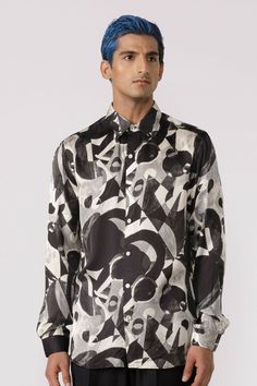 Full sleeve printed shirt in an abstract design Fit: Regular fit Color: blackFabric: Modal satin Designer Formal Printed Tops, Designer Printed Tops For Formal Occasions, Designer Silk Printed Shirt, Formal Silk Printed Shirt, White Silk Top With Graphic Print, Designer Long Sleeve Top With Abstract Print, Casual Black Silk Shirt, Formal Printed Silk Tops, Formal Silk Printed Tops