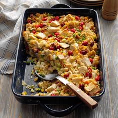 a casserole dish with chicken and vegetables in it