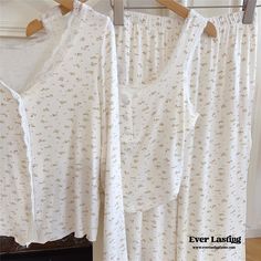 Expertly crafted for ultimate comfort, Ever Lasting's White Floral Pajama Set features a tank top, long sleeves, and long pants. Effortlessly stylish and great for soft girls and cottagecore lovers, it's perfect for a restful night's sleep. Made with high-quality polyester mixed fabric, it offers a luxurious feel while ensuring breathability and durability. Enhance your sleepwear collection with this timeless set. Features: Ultra Soft Relax Fit (stretchy waistband) Breathable (great for all seasons) Sweet Lace Details Great Gift: Full Lounge Set Machine Safe General Size Guide: Size S/M -> Size 0 - 4 Size M/L-> Size 4 - 8 Size L/XL -> Size 8 - 12 Size XL/XXL -> Size 12 - 14 Size XXL/XXXL -> Size 14 - 16 Looking for more coziness? Shop our loungewear collection. White Long Pants Sets For Daywear, White Long Pants Sets For Spring, Spring Daywear Sets With Long Pants, Cottagecore White Sleepwear For Spring, White Cottagecore Sleepwear For Spring, White Floral Print Sleepwear For Pajama Party, Casual Floral Print Sleepover Sets, Princesscore Pajamas, Fitted White Floral Print Sleepwear