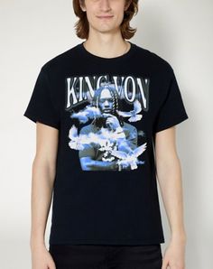 a man wearing a black t - shirt with the words kingwon on it