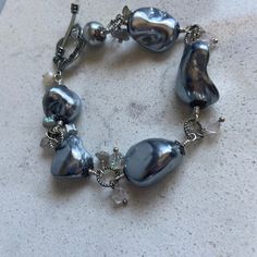 "Hand made Silver Baroque Pearls original design hand wired gray silver tone jewelry bracelet one of a kind OOAK I used the prettiest large gray baroque pearls for this bracelet. All hand made by me.   bracelet is 8\" long , adjustable   Please click on ZOOM below the photo for a huge closeup! Thanks for visiting my shop! Ask for the discounts if buying more than one lot Please check my other Etsy shop AnnaGraceDreams for vintage jewelry and one of a kind creations made by me.  https://www.etsy.com/shop/AnnaGraceDreams  Also please check my blog for updates at AnnaGraceDreams.com" Adjustable Gray Metal Jewelry, Silver Beaded Bracelets With Unique Variations, Silver Metal Pearl Bracelet For Party, Nickel-free Gray Metal Jewelry, Artisan Silver Beaded Bracelets With Unique Variations, Adjustable Silver Pearl Bohemian Bracelet, Adjustable Silver Bohemian Pearl Bracelet, Adjustable Silver Pearl Bracelet In Bohemian Style, Unique Metal Wire Wrapped Beaded Bracelets