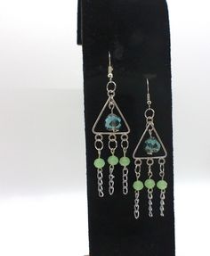 Add a touch of nature-inspired charm to your jewelry collection with these wire dangle earrings. Handcrafted with care, these earrings feature intricately beaded glass beads in a gorgeous shade of earthy green. The delicate silver wire adds a hint of elegance, creating the perfect accessory for any occasion. Embrace your love for all things green with these unique and eye-catching earrings, a true reflection of the beauty found in the natural world. To prolong the life of your jewelry remember t Pretty Beaded Jewelry, Earthy Green, Bronze Earrings, All Things Green, Water Activities, Etsy Earrings Dangle, Silver Wire, Green Glass, Nature Inspired