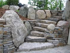 a stone wall with steps made out of rocks