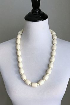 This is a traditional West African off-white beaded necklace. These jewelry pieces are unisex and are designed to be worn by adults Beads are made of resin Length ( from neck to chest): 14 inches *** Each Necklace comes with a matching bracelet These beaded jewelry is an integral part of West African culture. Traditionally it is worn by Royalty, Chiefs, and those who are part of the Royal households among many kingdoms in West Africa. It is also worn by brides and grooms during their wedding cer Classic White Beaded Necklaces, White Beaded Necklaces With Oval Beads, Classic White Beaded Necklace, White Jewelry With Oval Wooden Beads, Spiritual Single Strand White Necklace, White Large Beads Spiritual Jewelry, Vintage White Necklaces With Large Beads, White Single Strand Spiritual Necklace, Cream Necklaces With Round Beads For Jewelry Making