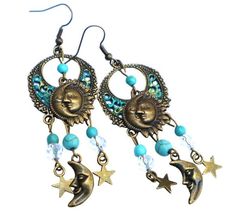 "Add funky Celestial style to your outfits by slipping on these whimsical earrings featuring a bunch of dangling sun & moon charms and hand-accented filigree pendants!  Little stars and a half moon swing beneath turquoise blue magnesite beads and faceted glass beads for fun movement! And they're super comfy to wear because they are lightweight...so no annoying pulling on your ears as they sway! A cute addition to your jewelry box or a great gift idea! Antiqued Gold-plated Earwires, Antiqued Gold Bohemian Sun And Moon Earrings For Festivals, Bohemian Summer Jewelry With Sun And Moon Design, Bohemian Sun And Moon Design Earrings For Festival, Bohemian Sun And Moon Design Jewelry For Summer, Bohemian Dangle Earrings With Sun And Moon Design, Bohemian Dangle Earrings With Sun Design, Bohemian Sun Design Dangle Earrings, Sun And Moon Design Dangle Earrings For Summer, Whimsical Earrings