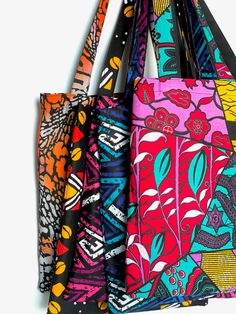 Whether for grocery shopping, carrying your laptop or even trick-or-treating, the Ankara Market Tote is the perfect solution for throwing it all in the bag. The tote features long straps and is fully lined in cotton/polyester blend fabric. **NOTE: Some fabrics have varying colors and prints, therefore no two totes will look the same. | The Details | 100% Cotton Ankara fabric Fully lined with cotton/polyester fabric Measures 14"W, 16"H; 12" shoulder strap drop Ankara fabric is a printed fabric deriving from the continent of Africa. This fabric is often waxed, giving it a stiff texture. The wax has been washed from the Ankara fabrics used for the totes, leaving a soft and moveable fabric. | Shipping | Your tote ships via USPS Mail with tracking. Black Reusable Shoulder Bag For Shopping, Reusable Black Shoulder Bag For Shopping, Multicolor Bag With Laptop Sleeve For Daily Use, Ankara Tote Bag, Multicolor Laptop Sleeve Bag For Everyday Use, Orange Rectangular Reusable Bags, Reusable Multicolor Market Bags, Cotton Polyester Fabric, Sewing Tutorials Clothes