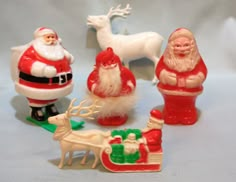 christmas figurines including santa claus, reindeer and sleigh