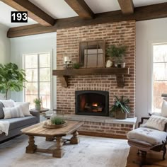 a living room with two couches and a fire place in it's center