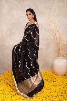 Expertly crafted with pure Katan silk, this black Banarasi saree features intricate Kaduwa sona rupa motifs. The traditional design and luxurious fabric make it a versatile addition to any wardrobe. Elevate your style with this exquisite and timeless piece. Black Cotton Silk Traditional Wear With Resham Embroidery, Black Traditional Wear With Resham Embroidery In Cotton Silk, Black Silk Saree With Resham Embroidery, Black Silk Pre-draped Saree With Resham Embroidery, Black Cotton Silk Pre-draped Saree With Zari Work, Black Dupatta For Designer Wear & Transitional Seasons, Black Art Silk Pre-draped Saree With Zari Weaving, Black Pre-draped Saree With Zari Weaving For Puja, Black Designer Wear Dupatta For Transitional Season