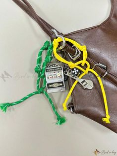 a purse with some keys attached to it