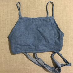 Brandy Melville Tie Back Crop Top. Never Worn By Me, Purchased From Another Seller. Rare. One Size But Fits Extra Small-Small, Maybe Medium Since It Ties In The Back. Summer Denim Blue Cotton Top, Summer Cotton Top In Denim Blue, Blue Chambray Denim Top For Summer, Medium Wash Cotton Top For Beach, Cotton Beach Top, Medium Wash Cotton Tops For The Beach, Light Blue Chambray Tops For Summer, Cotton Tops For Beach, Blue Denim Crop Top For Summer