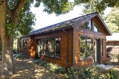 an image of a small wooden cabin in the woods