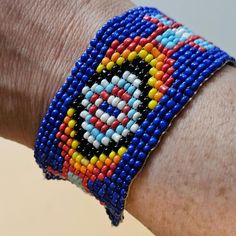 Vintage Native American blue seed bead bracelet with diamond pattern that almost looks like an eyeball. Also has a plus sign shaped detail. 

Closure is adjustable with three options for size. Length of bracelet including all three sized loops is about 9 inches, Very good pre-loved condition with only light wear See photos for measurements and condition questions. #native #tribal #vintage Seed Bead Bracelet, Seed Bead Bracelets, Women Accessories Jewelry, Diamond Pattern, Bead Bracelet, Seed Bead, Women's Jewelry, Nativity, Seed Beads