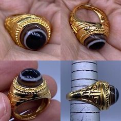 two pictures of gold rings with black stones in them