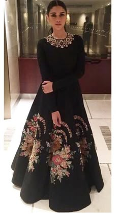 This Black color floor length gown is featured in the dupion silk with hand embroidered gold color embroidery on the panels.Can be customised in any color of your choice. Salwar Kamiz, Red Lehenga, Hippy Chic, Winter Dress Outfits, Indian Gowns Dresses, Long Frocks, Indian Bridal Fashion, Indian Gowns, Dress Indian Style