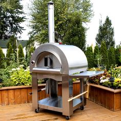 The Italian inspired PINNACOLO PREMIO is built for years of reliable performance while providing you with fabulous wood fired flavor. The well insulated double-walled dome and matching cart are built of heavy gauge stainless steel. The Cordierite cooking surface offers great heat retention, thermal shock resistance and enough space for 2-3 pizzas at once. A convenient stainless steel side shelf is ready for easy prep. There is secure fitting door, a built-in thermometer, hangers ready for your c Pizza Tumblr, Pizza Photography, Aesthetic Pizza, Pizza Aesthetic, Outdoor Pizza Ovens, Portable Pizza Oven, Wood Burning Pizza Oven, Brick Hearth, Four A Pizza