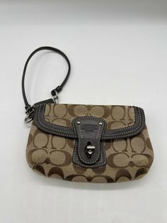 Coach casual wristlet purse bag with zipper and leather strap Measures approx 7" across Payment Details: Thanks for checking out our items! Global Shipping Program applies to International buyers No returns, no exchanges, no refunds What you see in the picture is what you get...ask all questions in advance Payment due immediately - no payment delays. If you accept my offer or my counter-offer, I expect payment ASAP or order will be cancelled next day. Please note – I cannot send emails when item Wristlet Wallet Aesthetic, Micro Purse, Current Joys, Pastel Kitchen, Pretty Purses, Payment Due, Wristlet Bag, Dream Bags, Wristlet Purse