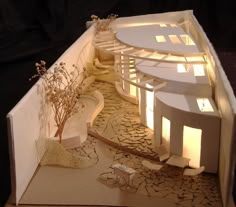 a paper model of a house on display