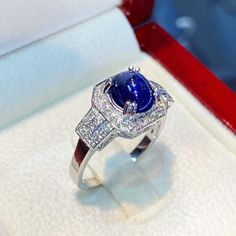 BRAND-NEW!! ONE OF A KIND, HANDCRAFTED RING. EXTREMELY STUNNING! 2.37 total carats Certified HEATED, CEYLON BLUE SAPPHIRE ring. This ring offers an important statement of who you are with a 1.95 carats, VIVID ROYAL BLUE, transparent SAPPHIRE. Accentuating the sapphire are the 36 F/VS, and sparkling natural diamonds! Set in finest 18K Solid White Gold ring! THE ITEM YOU SEE IN THE PICTURES IS THE EXACT ITEM YOU WILL GET! ONE OF A KIND, NO DUPLICATES OR TWINS SUGGESTED RETAIL VALUE: $6,500 BLUE SA Fine Jewelry Sapphire Cabochon Ring With Diamonds, Elegant Sapphire And Diamond Ring With Cabochon Cut, Elegant Sapphire Ring With Cabochon Diamond, Luxury Sapphire Cabochon Ring For Anniversary, Sapphire Diamond Cabochon Rings, Elegant Cabochon Sapphire Ring For Formal Occasions, Elegant Cabochon Sapphire Ring, Elegant Formal Cabochon Sapphire Ring, Elegant Formal Sapphire Cabochon Ring