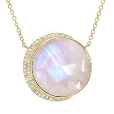 Be bold and unique with this stunning larger size moon phase necklace. Featuring a truly breathtaking 16mm diameter center stone, cut in-house from all-natural materials, and nestled into a custom-made gold setting with natural, conflict-free diamonds, this gorgeous necklace is sure to become the centerpiece of your jewelry collection. Rainbow moonstone, a feminine stone with relaxing energy, is a great choice for this bold contemporary style. We use all-natural stones in each and every piece we Luxury Moon Shaped Necklace, Elegant Round Crystal Necklace With Moon Charm, Luxury Moonstone Necklace With Gemstones, Moonstone Crystal Necklace With Moon Phase, Moonstone Necklaces With Gemstone Accents, Round Moonstone Necklace With Gemstone Accents, Moon Phases Necklace, Rainbow Moonstone Necklace, Moonstone Necklace