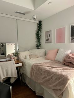 a bedroom with a bed, desk and mirror