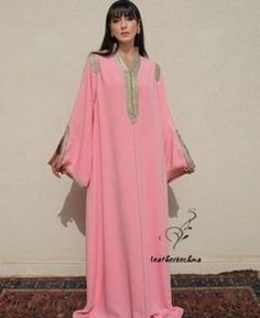 this stunning embroidered Moroccan kaftan is beautifully handcrafted by high skilled artisans from Morocco . both embroidery and beading are handmade . the fabric is so soft and comfy what makes it comfortable and elegant at the same time. this moroccan dress is easy to wear and will turn heads at any occasion, weddings, eid, baby shower, Ramadan ..etc *Product Describe Dress Style : kaftan THANK YOU VISIT AGAIN Festive Long Sleeve Thobe With Zari Work, Bohemian Wedding Abaya With Dabka, Pink Bohemian Kaftan For Evening, Long Abaya With Dabka Work For Evening, Anarkali Kaftan With Long Sleeves And Dabka Work, Anarkali Abaya With Zari Work And Long Sleeves, Bohemian Long Thobe For Wedding, Elegant Floor-length Maxi Dress With Dabka Work, Elegant Long Abaya With Dabka Work