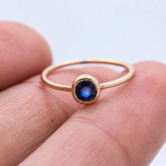 Genuine Blue Sapphire Ring, Minimalist Blue Sapphire Ring, 9k Gold Blue Sapphire Ring, Vintage Blue Sapphire Ring, Stacking Sapphire Ring  GEMSTONE DETAILS : ✦ Gemstone : Sapphire ✦ Gemstone Shape : Round  ✦ Gemstone Color : Blue  ✦ Gemstone Cut : Faceted ✦ Number of Gemstones : 1 ✦ Gemstone Weight : 0.3 CT's  ✦ Number of Gemstones : 1 ✦ Gemstone Grade: Excellent METAL DETAILS : ✦ Metal : 9K Yellow Gold ✦ Ring Size : 5 US  ✦ Gross Weight : 0.9 Gram  ✦ Setting : Bezel Setting  ✦ Ring Box : Yes CU Sapphire Stackable Birthstone Rings, Blue Sapphire Ring In 14k Gold, Blue Birthstone Promise Ring, Blue Sapphire Stackable Rings For Promise, Blue Gemstone Midi Promise Rings, Blue Round Band Stackable Rings For Promise, Blue 14k Gold Stackable Rings As Gift, Blue Birthstone Jewelry With Round Band, Blue Stackable Jewelry For Everyday